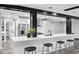 Modern open-concept kitchen with white countertops, stainless steel appliances, and seating at 505 Lake Shore Dr, Maitland, FL 32751