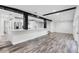 Bright, open-concept living room flows into a kitchen featuring modern appliances and an island counter at 505 Lake Shore Dr, Maitland, FL 32751