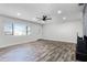Bright and airy living room with large windows and hardwood floors, featuring a fireplace at 505 Lake Shore Dr, Maitland, FL 32751
