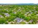 A neighborhood viewed from above, highlighting mature trees and the meticulously maintained houses in the surrounding area at 532 Worthington Dr, Winter Park, FL 32789