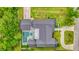 Aerial view of the home featuring a rectangular pool, patio, lush landscaping, and a driveway leading to the main street at 532 Worthington Dr, Winter Park, FL 32789