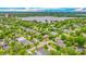 Aerial view showcasing the surrounding neighborhood with mature landscaping and the lake in the distance at 532 Worthington Dr, Winter Park, FL 32789