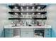 Detailed view of the bar area with ample storage, marble countertop, and sleek shelving at 532 Worthington Dr, Winter Park, FL 32789