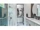 Contemporary bathroom with shower and vanity, accented by unique artwork at 532 Worthington Dr, Winter Park, FL 32789