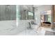 Spa-like bathroom with glass-enclosed shower and freestanding tub, open to bedroom at 532 Worthington Dr, Winter Park, FL 32789