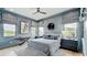 This bedroom features a ceiling fan, an area rug and window treatments at 532 Worthington Dr, Winter Park, FL 32789