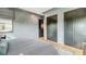 This bedroom features wood floors and a large closet at 532 Worthington Dr, Winter Park, FL 32789