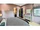 Bedroom boasts a mauve color scheme, modern lighting, sophisticated decor, and convenient access to a closet at 532 Worthington Dr, Winter Park, FL 32789