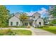 Beautiful two-story home featuring a well-manicured lawn, a palm tree, and a sleek, modern design at 532 Worthington Dr, Winter Park, FL 32789