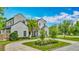 Elegant home featuring a manicured front lawn with palm trees and modern architecture at 532 Worthington Dr, Winter Park, FL 32789