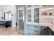Chic kitchen with a stainless steel fridge, custom cabinets, and view of a wine fridge at 532 Worthington Dr, Winter Park, FL 32789