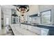 Bright, airy kitchen with large marble island, chef's range, and custom cabinets at 532 Worthington Dr, Winter Park, FL 32789