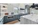 Gourmet kitchen with large island, stainless appliances, and stylish gray and white cabinetry at 532 Worthington Dr, Winter Park, FL 32789