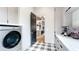 Adjacent to the kitchen, the spacious laundry room features modern washer/dryer and ample cabinet space at 532 Worthington Dr, Winter Park, FL 32789