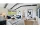 Spacious living room with exposed beams, neutral color palette, and abundant natural light at 532 Worthington Dr, Winter Park, FL 32789
