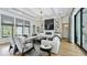 Bright living room with coffered ceiling, modern fireplace, and designer furniture at 532 Worthington Dr, Winter Park, FL 32789
