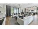 Open-concept living room connected to the kitchen with high end design, hardwood floors, and modern furniture at 532 Worthington Dr, Winter Park, FL 32789