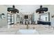 Modern home featuring an open layout with a kitchen island, dining space, and living room at 532 Worthington Dr, Winter Park, FL 32789