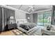 Luxurious main bedroom with large windows, stylish decor, and a view of the outdoor pool at 532 Worthington Dr, Winter Park, FL 32789