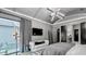 Elegantly designed main bedroom featuring plush seating, chic lighting, and outside view at 532 Worthington Dr, Winter Park, FL 32789