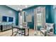Sophisticated office with custom desk, ample light, and stylish accents at 532 Worthington Dr, Winter Park, FL 32789