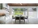 Outdoor kitchen featuring a built in grill and a dining area, sliding glass doors, and brick accents at 532 Worthington Dr, Winter Park, FL 32789