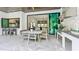 Outdoor kitchen featuring a full bar, dining area, built in grill, and a view of the indoor living room at 532 Worthington Dr, Winter Park, FL 32789