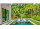 Inviting backyard pool with built in lounge chairs and manicured yard at 532 Worthington Dr, Winter Park, FL 32789