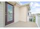 A close up of the balcony exterior door with a view of the building at 5826 Wooden Pine Dr, Orlando, FL 32829
