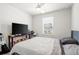 Simple bedroom with a bed, desk, and window, perfect for relaxing at 5826 Wooden Pine Dr, Orlando, FL 32829