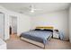 Bright bedroom with a comfortable bed, bedside tables, and neutral decor at 5826 Wooden Pine Dr, Orlando, FL 32829