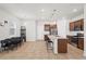 Open-concept kitchen with an island and stainless-steel appliances at 5826 Wooden Pine Dr, Orlando, FL 32829