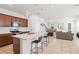 Modern kitchen with a large island, stylish pendant lights, and stainless steel appliances at 5826 Wooden Pine Dr, Orlando, FL 32829