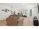 Comfortable living room with ample seating and an open floor plan at 5826 Wooden Pine Dr, Orlando, FL 32829