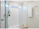 Shower with a frameless glass enclosure and a handheld showerhead at 5826 Wooden Pine Dr, Orlando, FL 32829