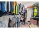 Spacious walk-in closet with organized shelving and ample storage space for clothes at 5826 Wooden Pine Dr, Orlando, FL 32829