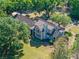Beautiful home from above, surrounded by mature trees and lush landscaping, providing a private oasis at 6037 Lake Erie Rd, Groveland, FL 34736