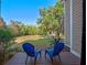 Relaxing back porch with seating and scenic views of the lawn at 6037 Lake Erie Rd, Groveland, FL 34736