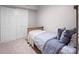 Simple bedroom with neutral colors, carpet floors and a double closet at 6037 Lake Erie Rd, Groveland, FL 34736