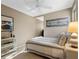 Bright bedroom features a comfortable bed and modern decorations, creating a relaxing and inviting atmosphere for rest at 6037 Lake Erie Rd, Groveland, FL 34736