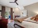 Cozy bedroom featuring a fireplace, french doors to backyard, and inviting decor at 6037 Lake Erie Rd, Groveland, FL 34736