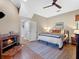 Bedroom boasts a cozy fireplace, neutral tones, and hardwood flooring, creating a serene and inviting atmosphere at 6037 Lake Erie Rd, Groveland, FL 34736