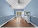 A beautiful dining room with pale blue walls and tiled floor at 6037 Lake Erie Rd, Groveland, FL 34736