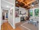 Cozy living room featuring a custom ceiling, a fireplace, built-in shelving, and lots of natural light at 6037 Lake Erie Rd, Groveland, FL 34736
