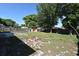 Spacious backyard with a firepit and mature trees providing shade at 607 Brittany Ct, Casselberry, FL 32707