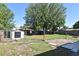 Spacious backyard featuring a shed and patio, perfect for outdoor activities and relaxation at 607 Brittany Ct, Casselberry, FL 32707