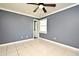Bedroom with a ceiling fan, tile floor, and neutral walls at 607 Brittany Ct, Casselberry, FL 32707