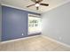 Bedroom features a window that provides natural lighting and tile flooring at 607 Brittany Ct, Casselberry, FL 32707