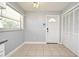 Bright kitchen with a window, adjacent to a door and closet space at 607 Brittany Ct, Casselberry, FL 32707