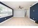 Bright living area with tile floors, a ceiling fan, and a large window to let in natural light at 607 Brittany Ct, Casselberry, FL 32707